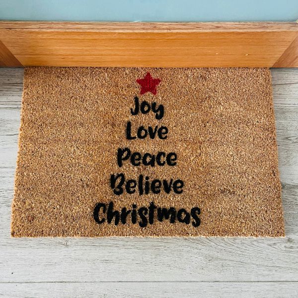 Doormat with words in shape of Christmas tree - Joy Love Peace Believe Christmas
