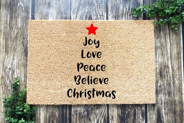 Doormat with words in shape of Christmas tree - Joy Love Peace Believe Christmas
