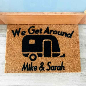 Doormat that says We Get Around Mike and Sarah with picture of caravan