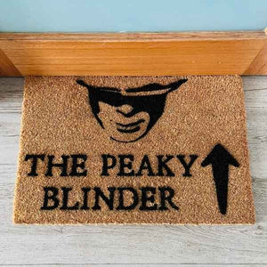 Custom doormat that says The Peaky Blinder with an arrow pointing upwards and picture of man from television show