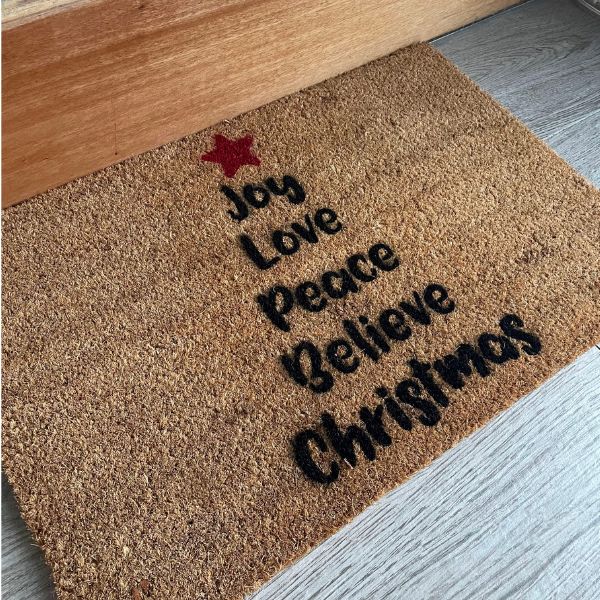 Doormat with words in shape of Christmas tree - Joy Love Peace Believe Christmas