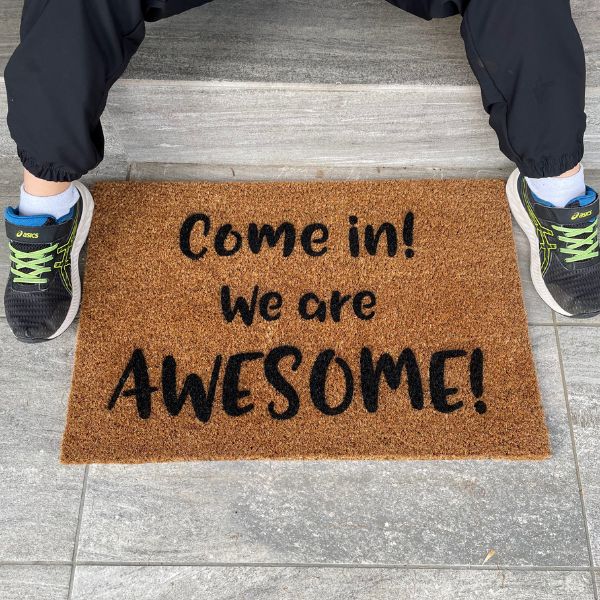 Doormat that says 'Come in! We are AWESOME!'
