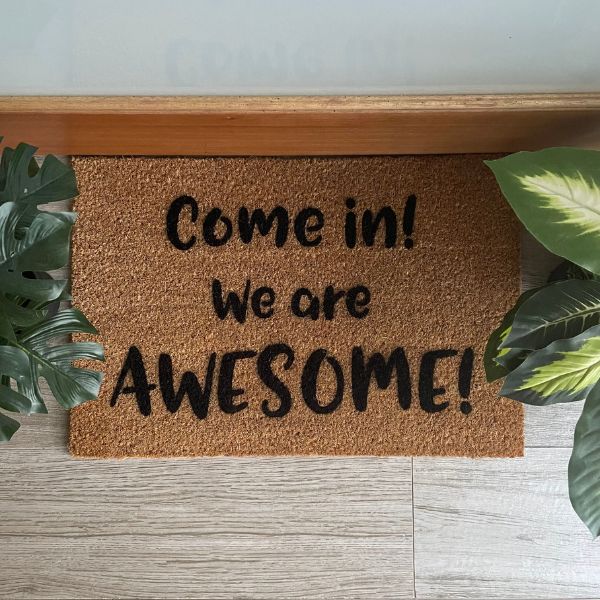 Doormat that says 'Come in! We are AWESOME!'