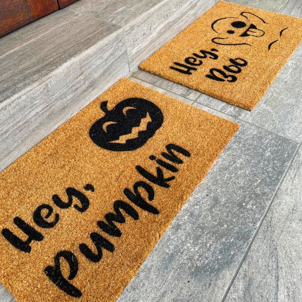 Halloween doormats that say 'Hey, Pumpkin' and 'Hey, Boo'