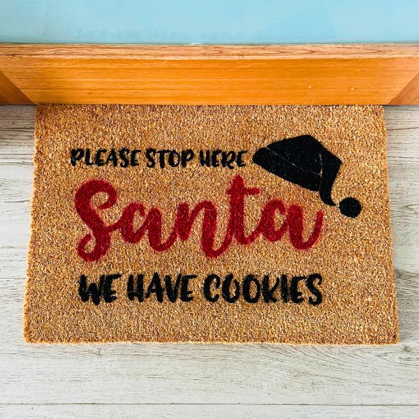 Doormat that says 'Please stop here Santa we have cookies'