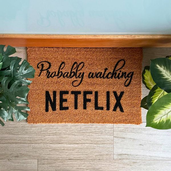 Probably watching Netflix doormat