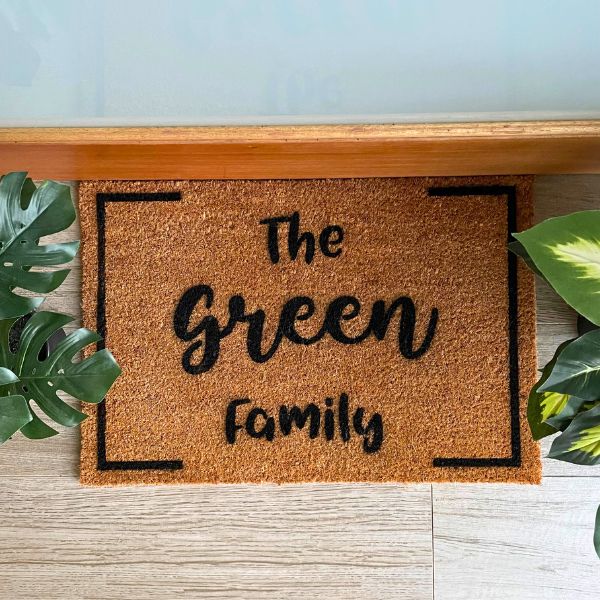 The Green Family doormat with border