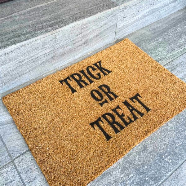 Halloween Doormat that says Trick or Treat