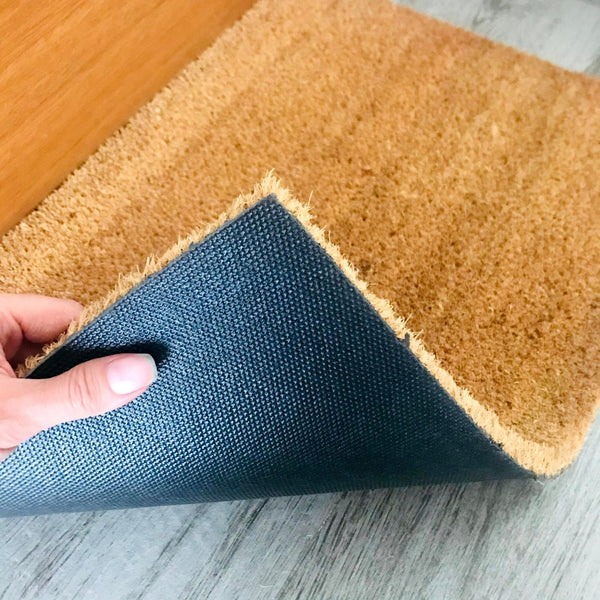 Non-slip backing underneath doormat