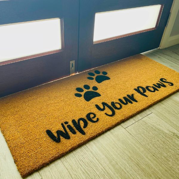Large Wipe Your Paws doormat with two paw prints