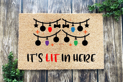 Doormat that says It's Lit In Here