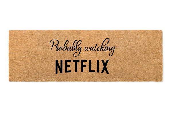 Large doormat that says 'Probably watching Netflix'