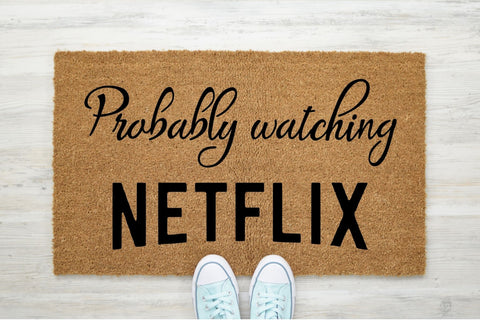 Doormat that says 'Probably watching Netflix'