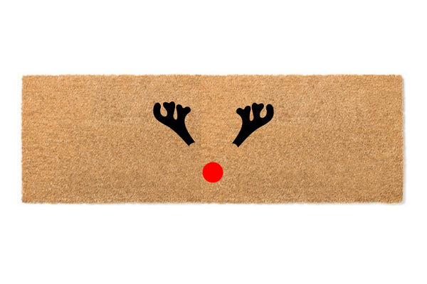 Large doormat with reindeer antlers and a red nose