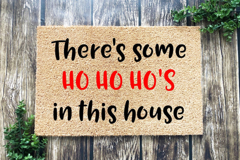 Doormat that says There's some HO HO HO'S in this house
